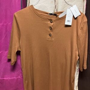 Shirt is extra large.  Is large on shoulders.  As is .
